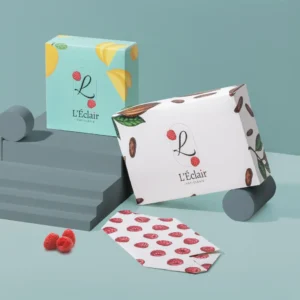 Custom four corner gift box printed with a cherry pattern, shown open beside a matching printed sheet.