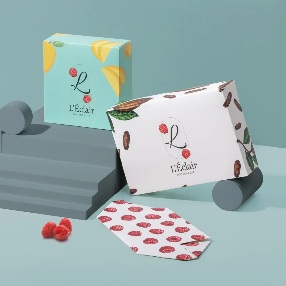 Custom four corner gift box printed with a cherry pattern, shown open beside a matching printed sheet.