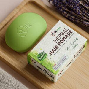 Custom organic soap box in printed kraft, shown on a wooden board beside an unwrapped soap bar.