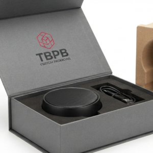 Custom foam and paperboard packaging inserts in a rigid box