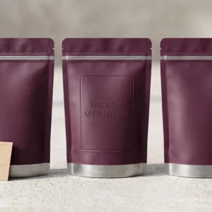 Three custom smell proof mylar bags in muted colors, each a stand up pouch with a resealable zipper and a foil barrier liner.